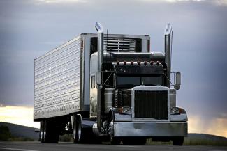 Semi-truck on the road carrying a full truckload shipment